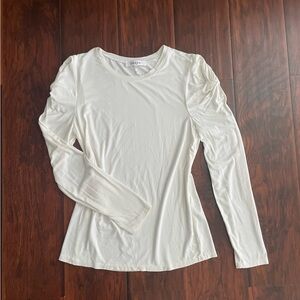 Woman’s FRAME ruffle shoulder long sleeve top